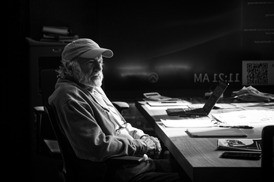 Bob Curtis working at a desk