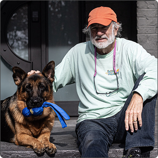 Bob Curtis with a German Shepard